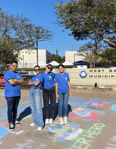 CTC event team members standing at the event entrance after the West Basin Water Harvest Festival 2023, smiling and celebrating a successful event